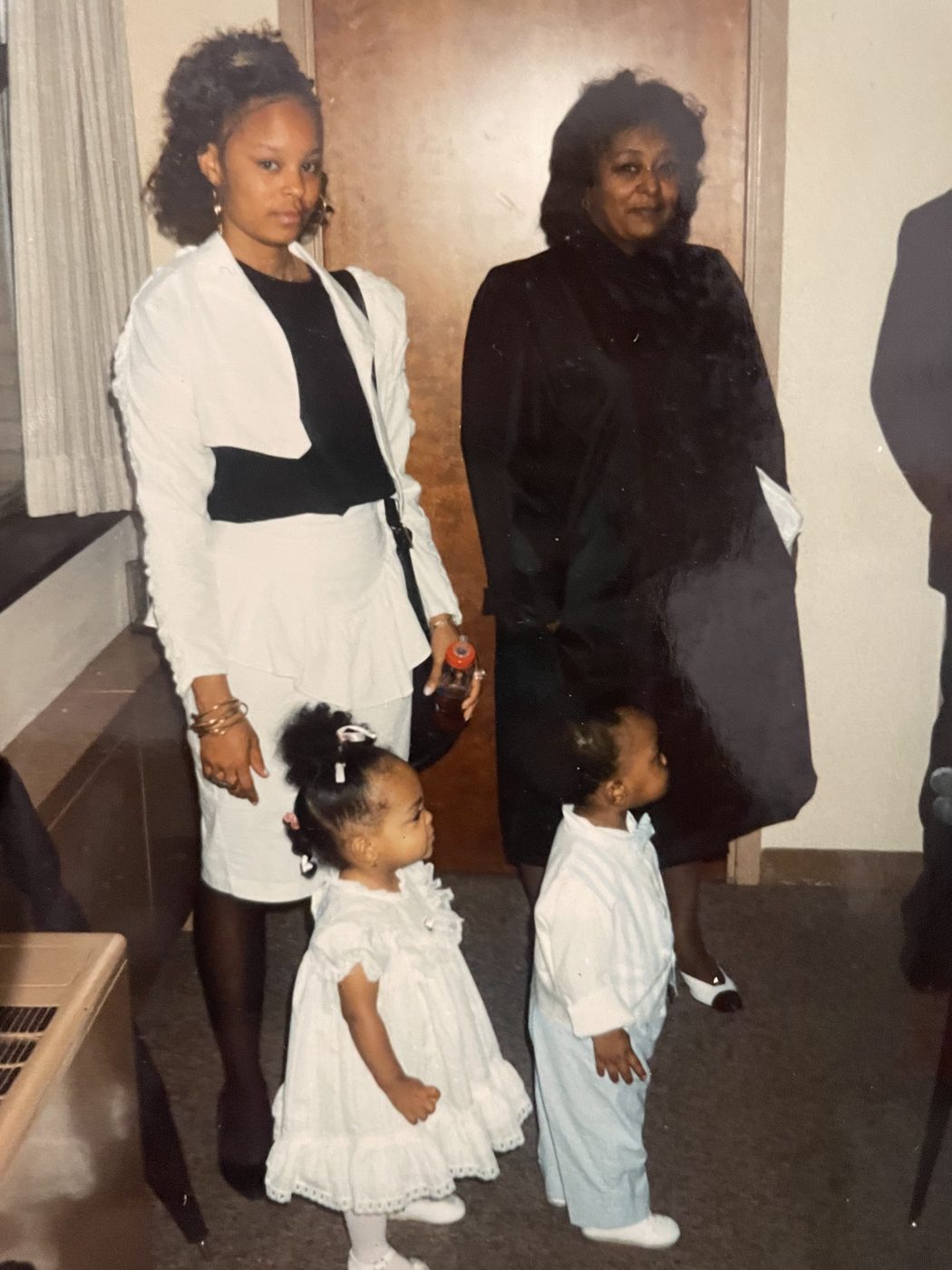 Sonya dressed up with family and two little ones