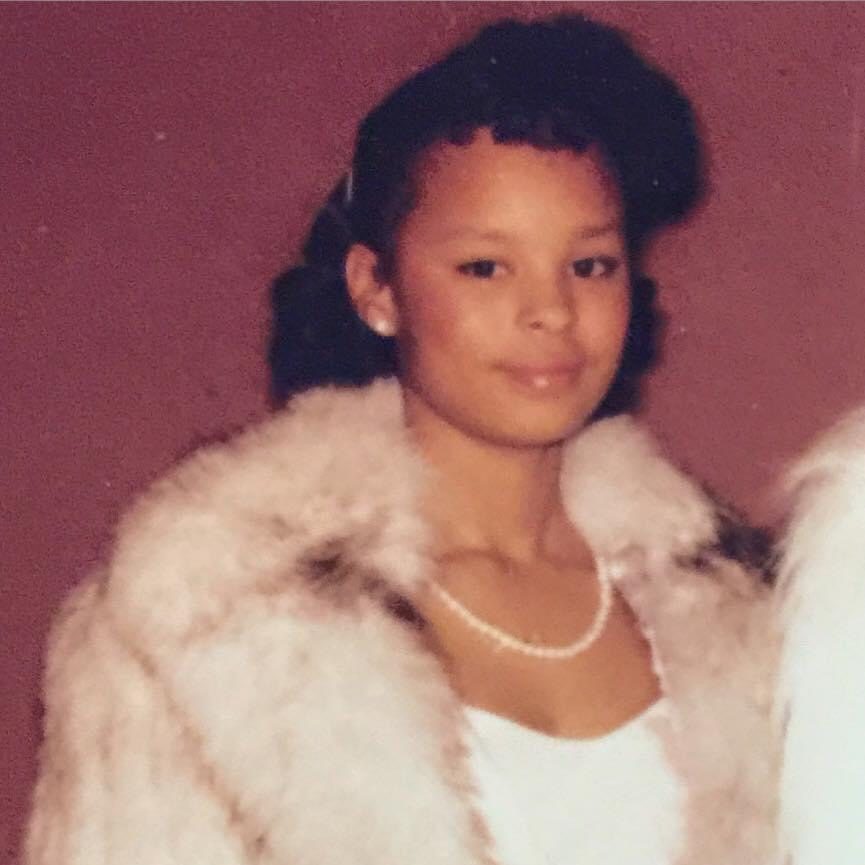 Sonya as a girl in a white fur coat and pearls