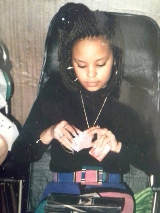 Sonya with braids, opening a gift
