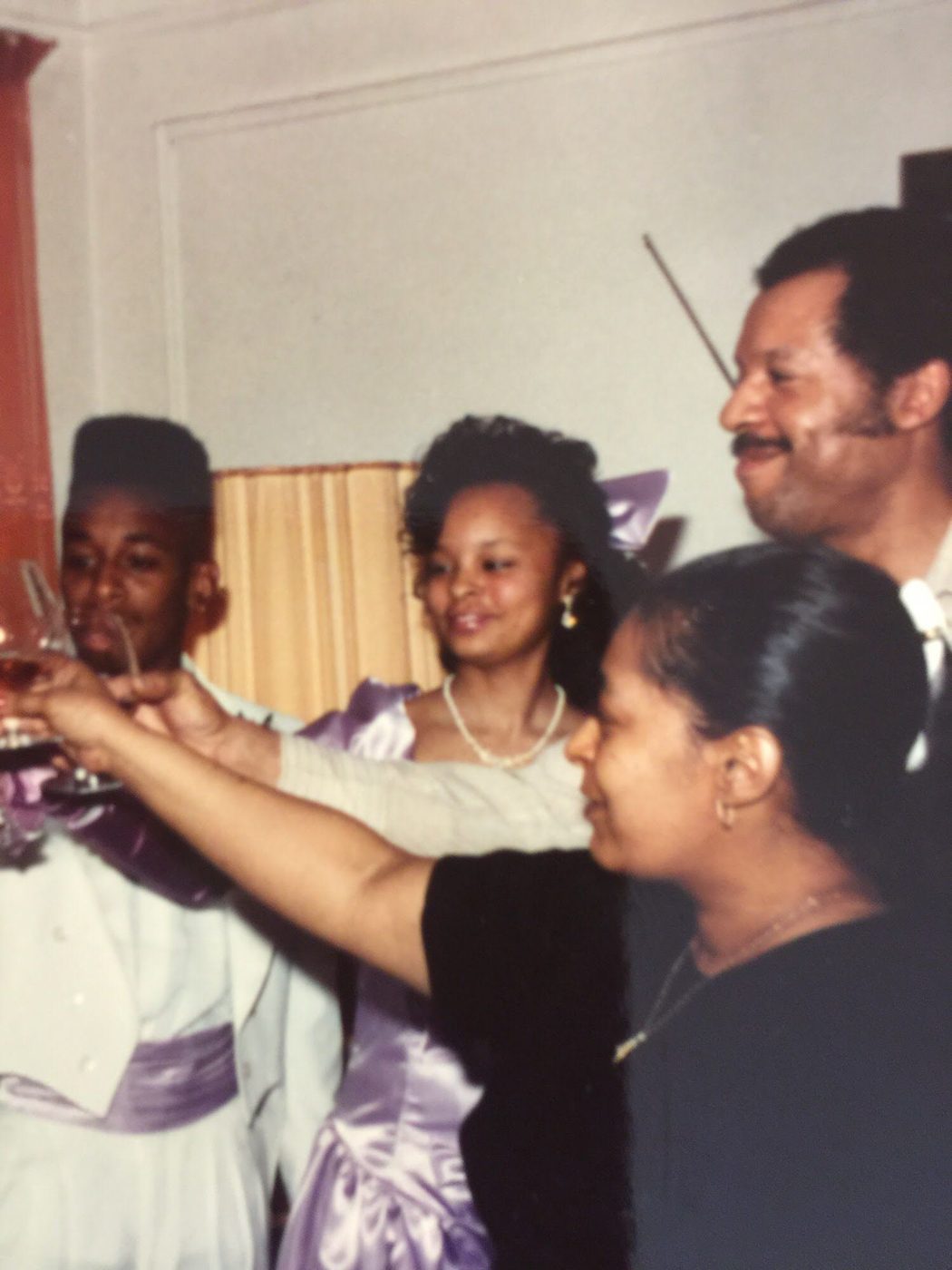Family raising a toast with Sonya in her lavender gown