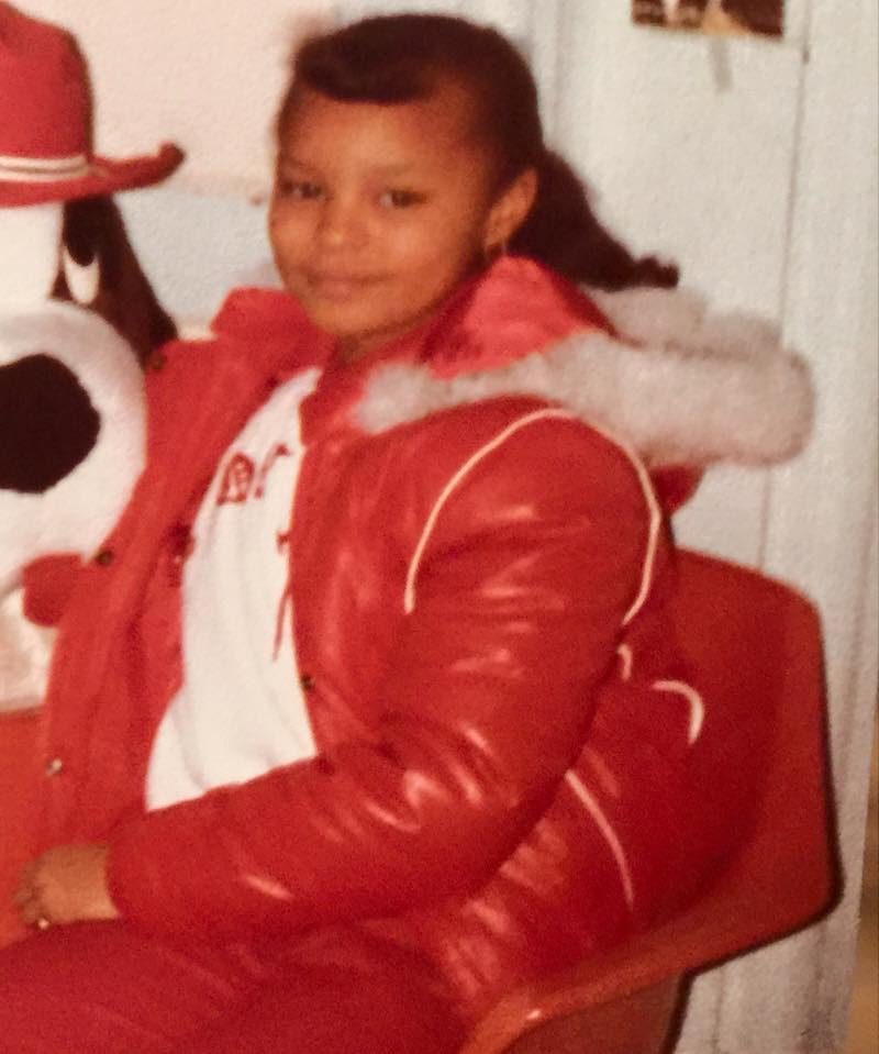 Sonya as a girl in a red winter jacket