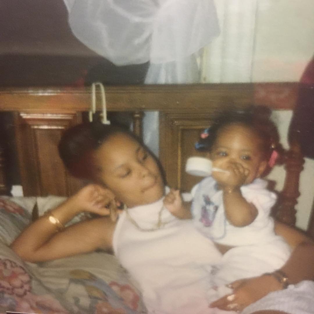 Sonya relaxing with a toddler